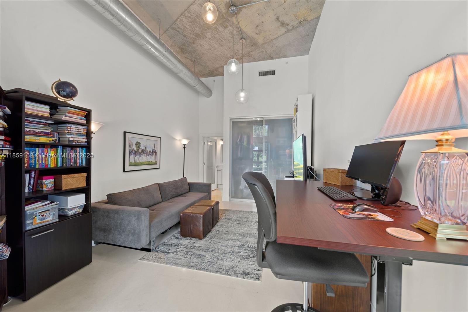 2001 Meridian Avenue, Unit 103 Miami Beach, FL 33139 - Photo 22 of 49 a view of a livingroom with workspace and a couch