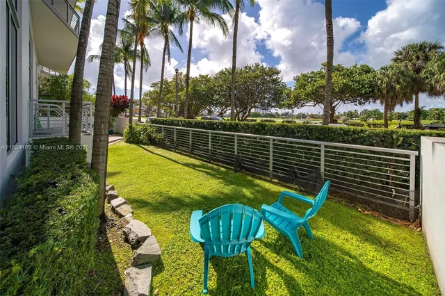 a view of a swimming pool with a patio and a garden