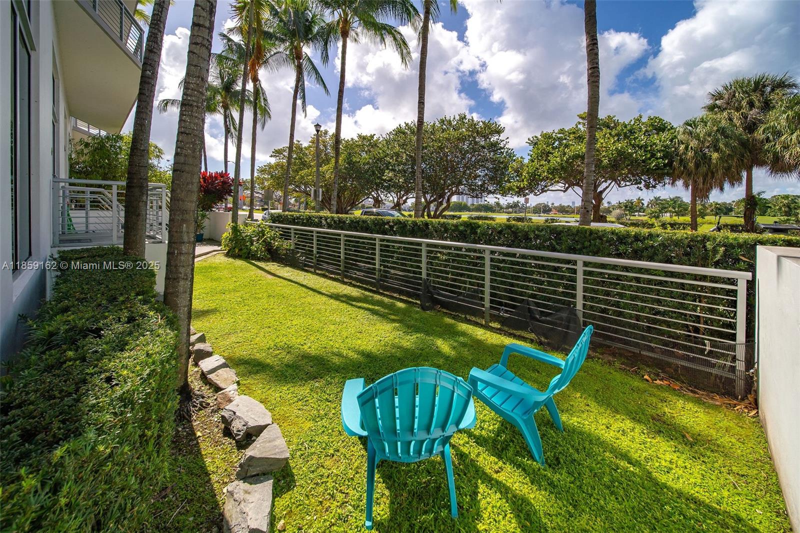2001 Meridian Avenue, Unit 103 Miami Beach, FL 33139 - Photo 26 of 49 a view of a swimming pool with a patio and a garden