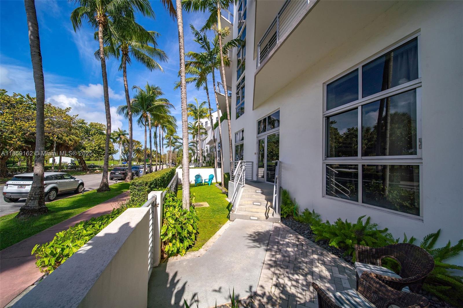 2001 Meridian Avenue, Unit 103 Miami Beach, FL 33139 - Photo 28 of 49 a view of a house with a yard and potted plants