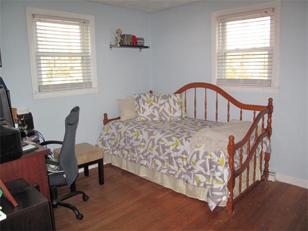 33 Edgewood Road Holbrook, MA 02343 - Photo 11 of 24 a large bed sitting in a bedroom next to a window