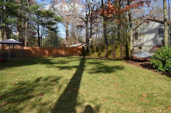 33 Edgewood Road Holbrook, MA 02343 - Photo 21 of 24 a backyard of a house with lots of green space
