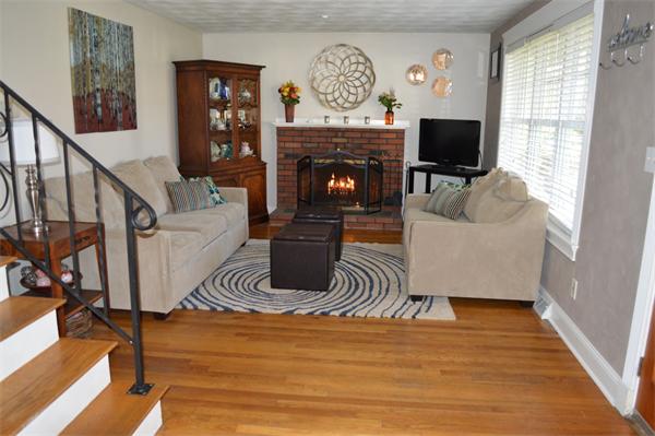 33 Edgewood Road Holbrook, MA 02343 - Photo 3 of 24 a living room with furniture a fireplace and a flat screen tv