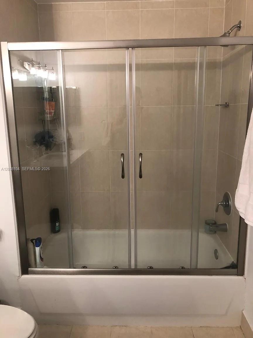 2400 Southwest 27th Avenue, Unit 304 Miami, FL 33145 - Photo 12 of 18 a bathroom with a shower and a bathtub