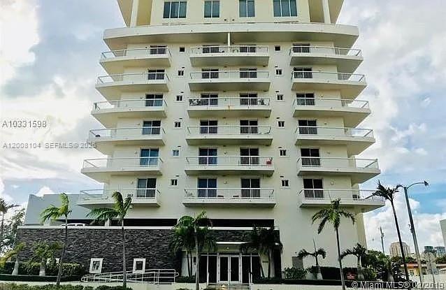 2400 Southwest 27th Avenue, Unit 304 Miami, FL 33145 - Photo 14 of 18 a front view of a multi story building