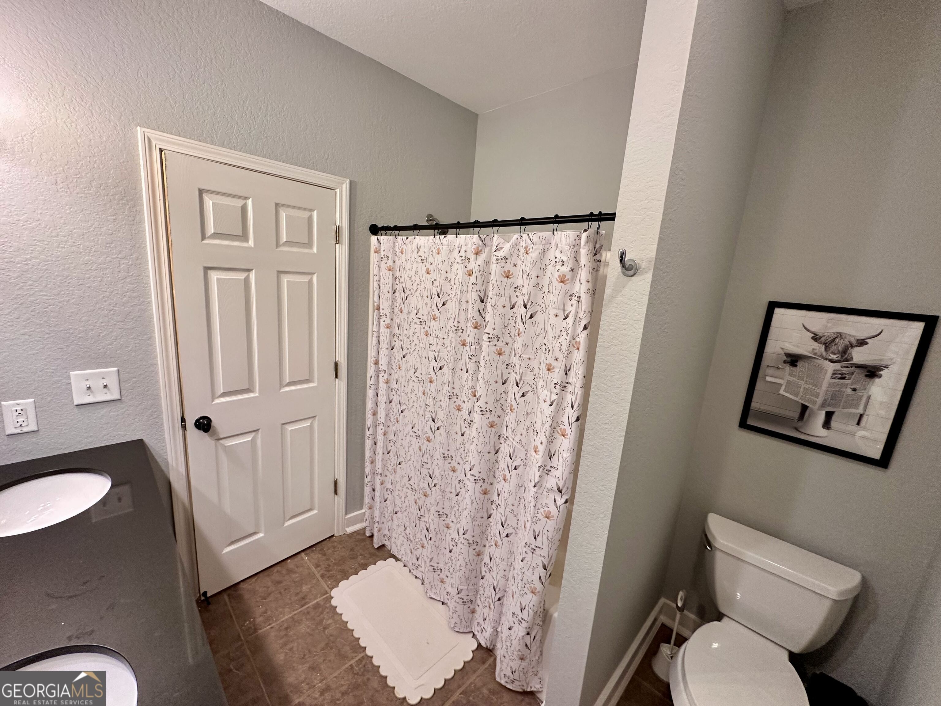 2769 Bean Creek Road Sautee Nacoochee, GA 30571 - Photo 16 of 33 a bathroom with a toilet and a shower curtain