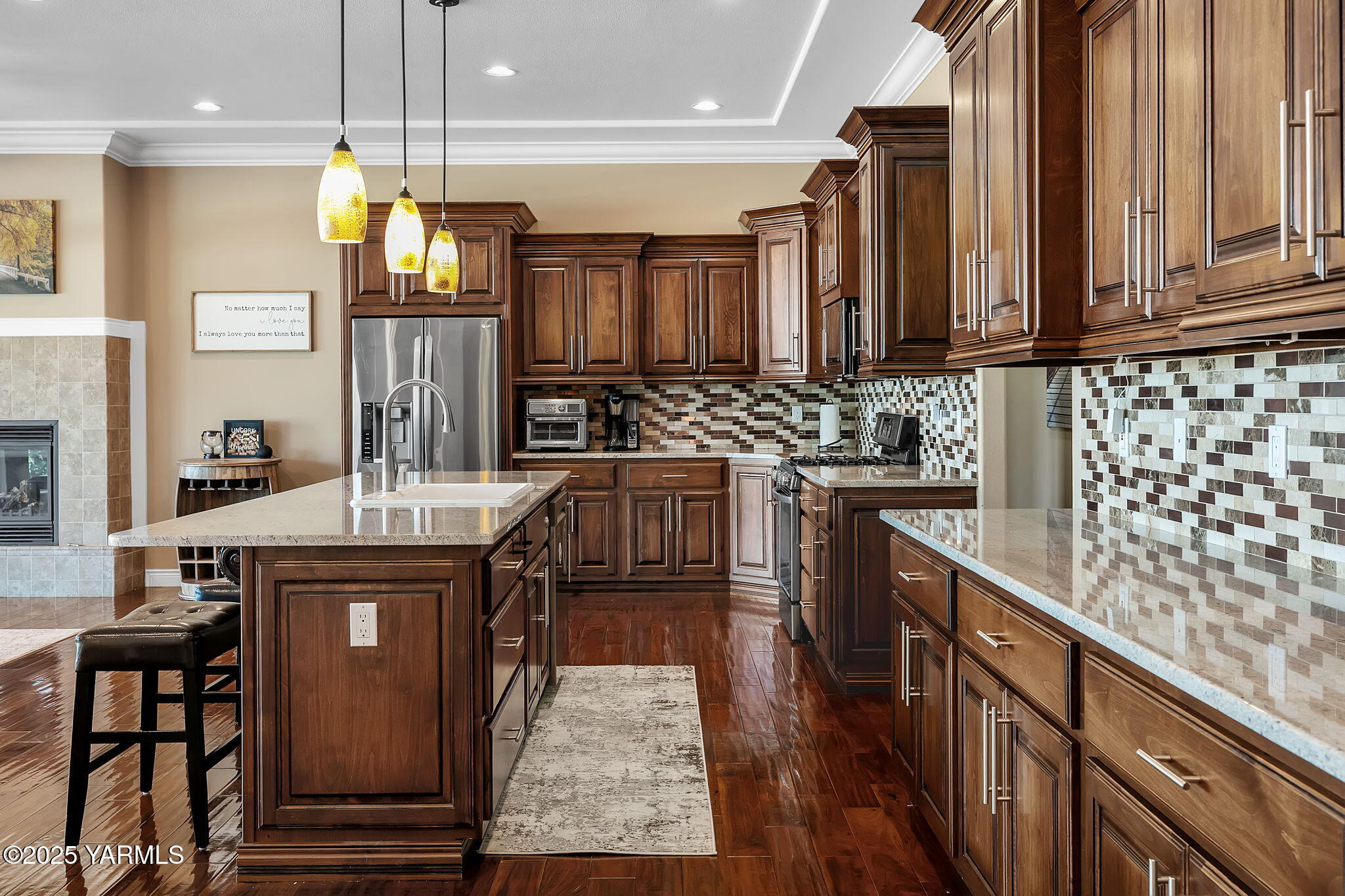 7501 Crestfields Road Yakima, WA 98903 - Photo 15 of 38 a kitchen with stainless steel appliances granite countertop a sink a stove and a refrigerator