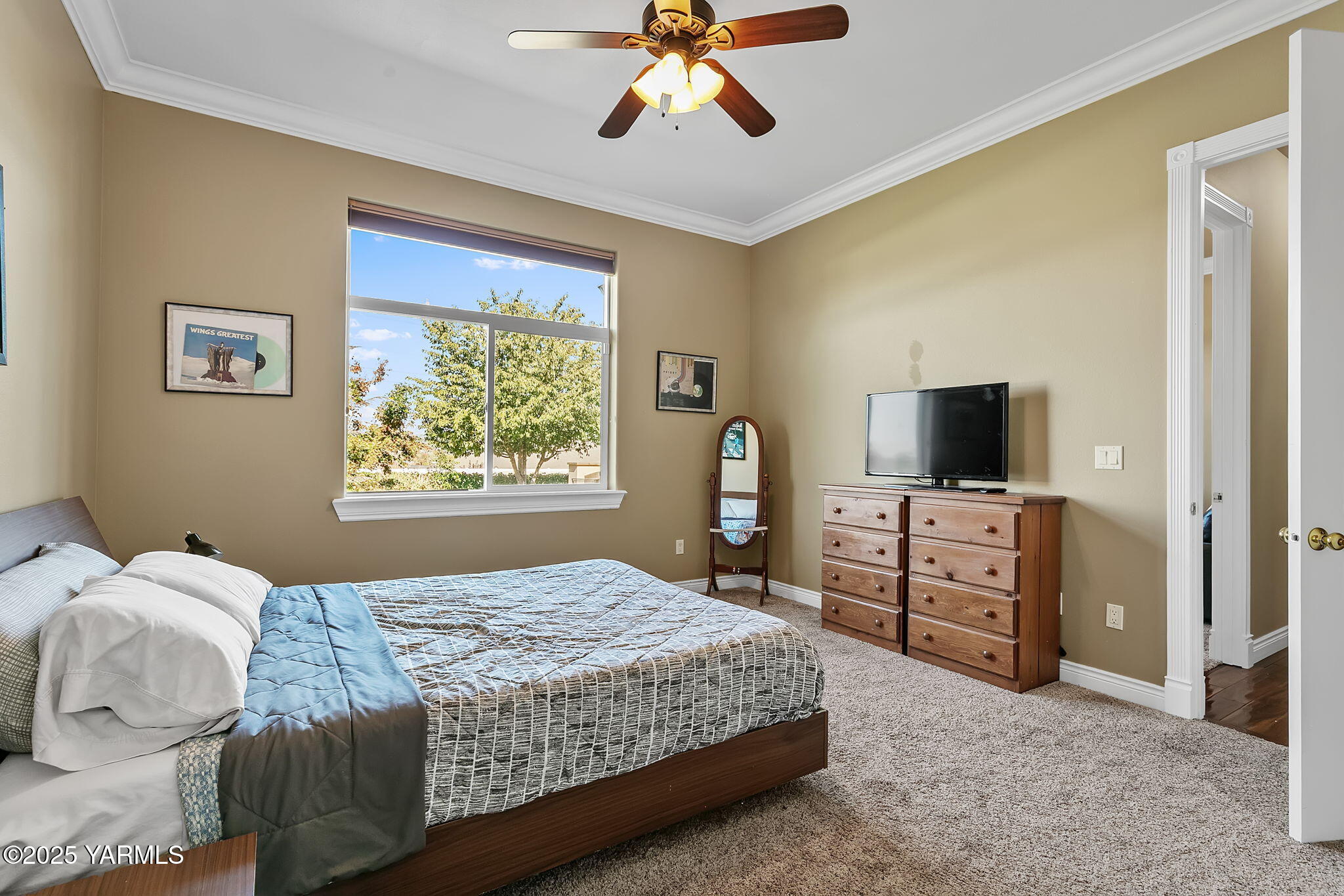 7501 Crestfields Road Yakima, WA 98903 - Photo 26 of 38 a bedroom with a bed and a flat screen tv