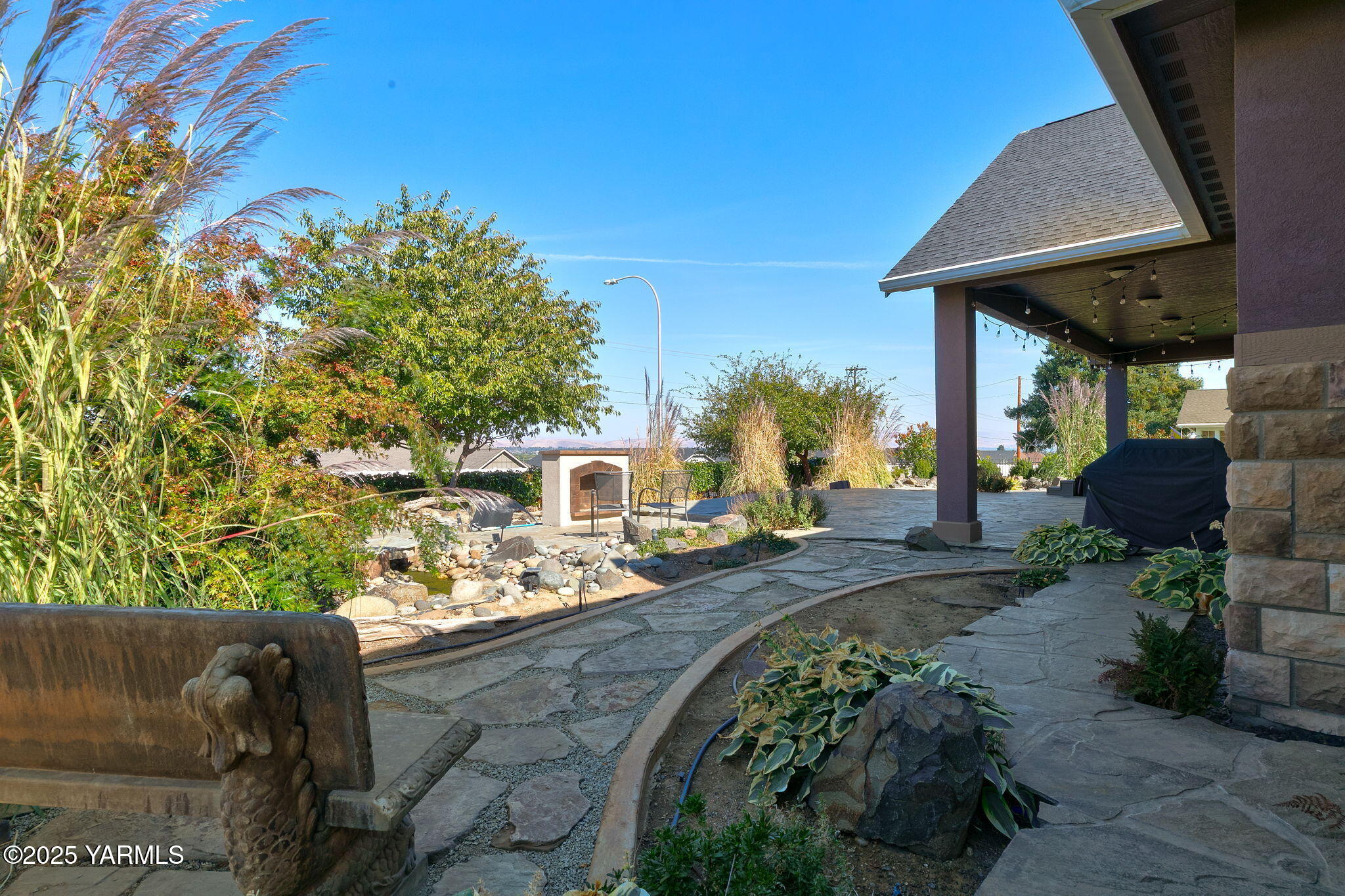 7501 Crestfields Road Yakima, WA 98903 - Photo 36 of 38 a front view of a house with garden