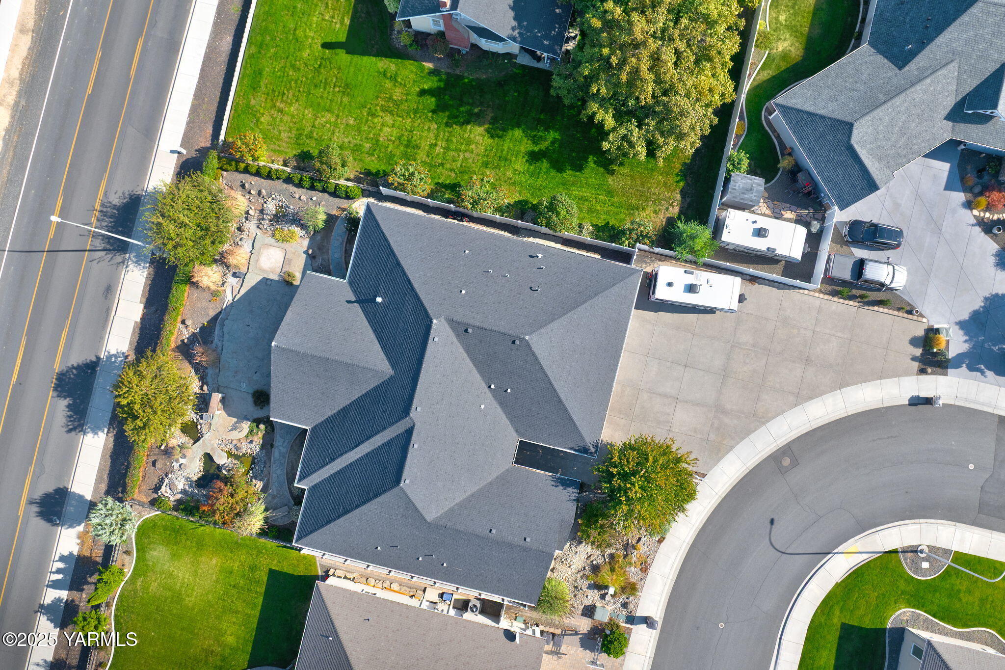 7501 Crestfields Road Yakima, WA 98903 - Photo 5 of 38 an aerial view of a house with a garden and trees