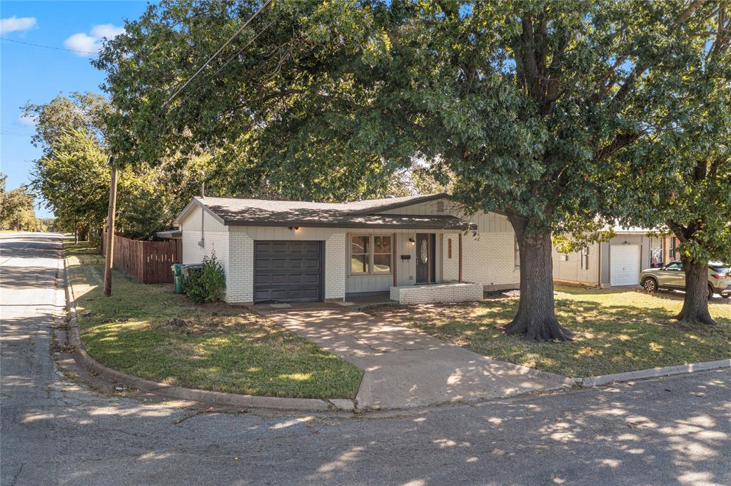 2221 North Alexander Street Sherman, TX 75092 - Photo 32 of 39 a front view of a house with a garden