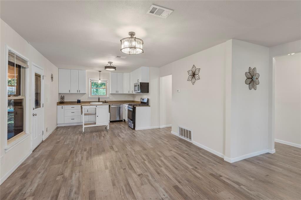 2221 North Alexander Street Sherman, TX 75092 - Photo 8 of 39 a view of a kitchen with microwave and cabinets