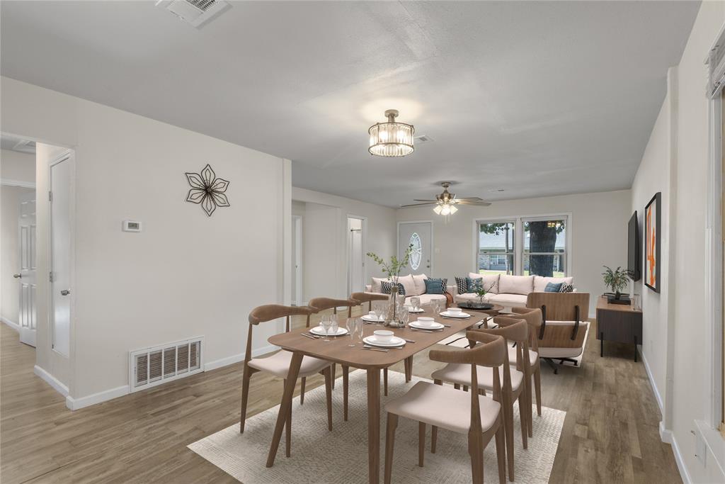 2221 North Alexander Street Sherman, TX 75092 - Photo 9 of 39 a view of a dining room with furniture and wooden floor