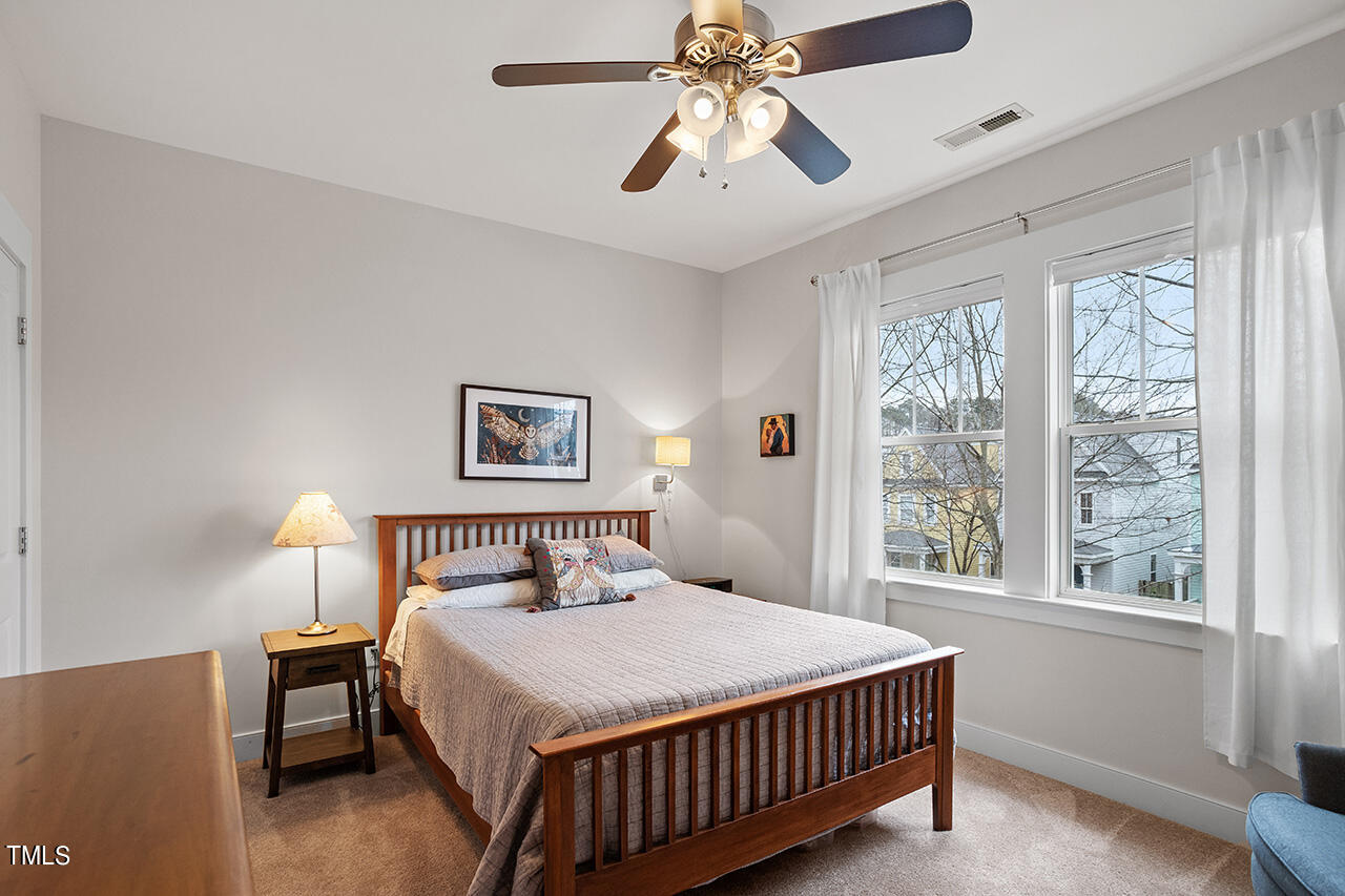 4526 All Points View Way Raleigh, NC 27614 - Photo 15 of 25 a bedroom with a large bed and a window