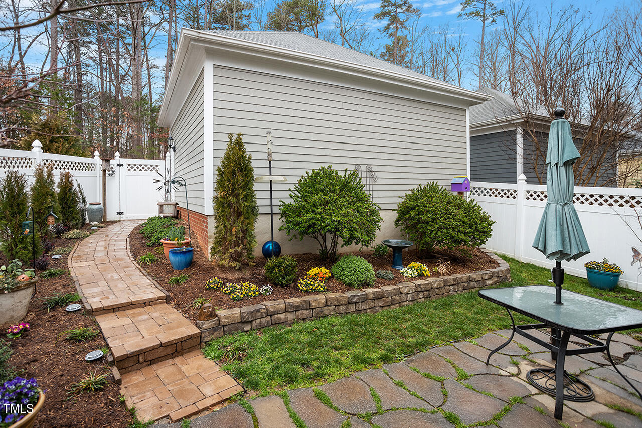 4526 All Points View Way Raleigh, NC 27614 - Photo 21 of 25 a view of a chair and table in backyard of the house