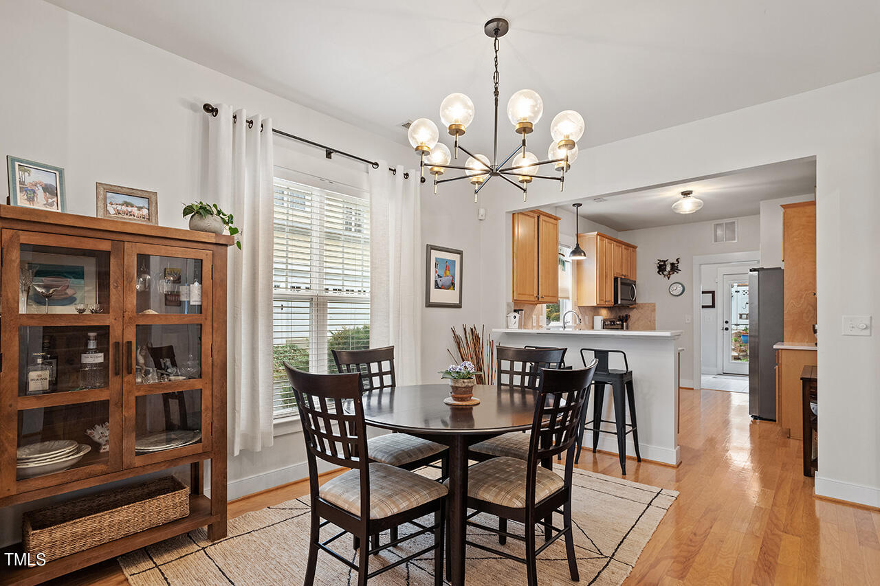 4526 All Points View Way Raleigh, NC 27614 - Photo 6 of 25 a view of a dining room with furniture window and wooden floor