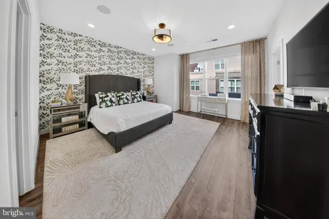 a bedroom with a bed and a television