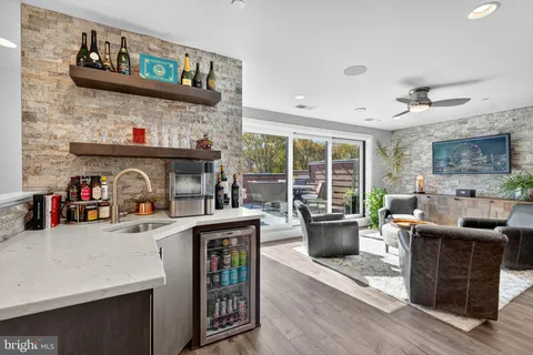 a kitchen view of counter top space a sink and wooden floor