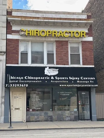 a front view of a building with glass windows and a rug