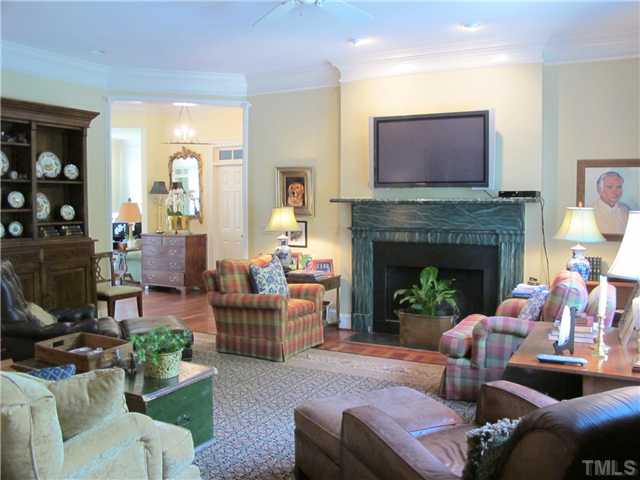 304 Marlowe Road Raleigh, NC 27609 - Photo 11 of 25 a living room with furniture and a fireplace