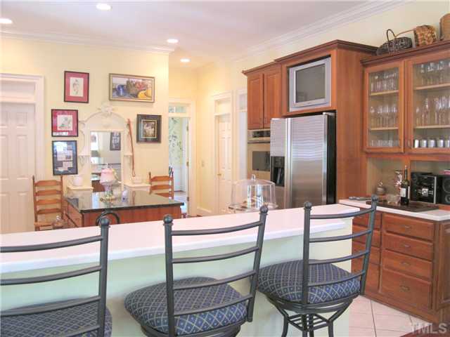 304 Marlowe Road Raleigh, NC 27609 - Photo 14 of 25 a kitchen with stainless steel appliances granite countertop a refrigerator and a stove top oven