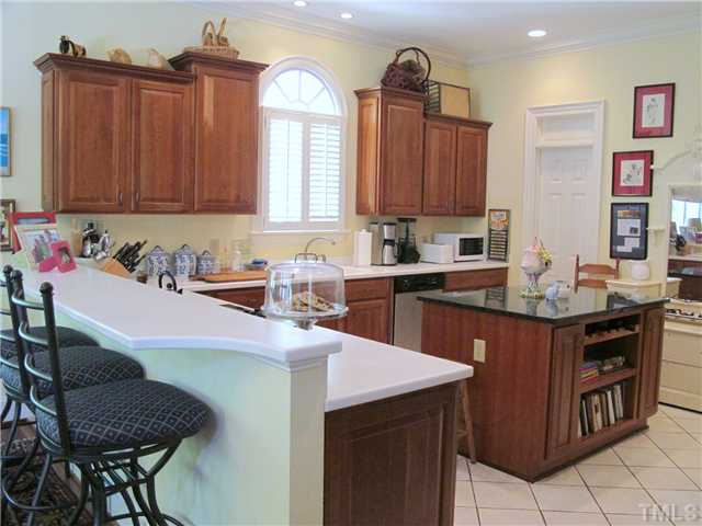 304 Marlowe Road Raleigh, NC 27609 - Photo 15 of 25 a kitchen with a sink cabinets and window