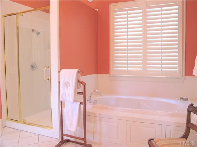 304 Marlowe Road Raleigh, NC 27609 - Photo 20 of 25 a bathroom with a bathtub and a shower