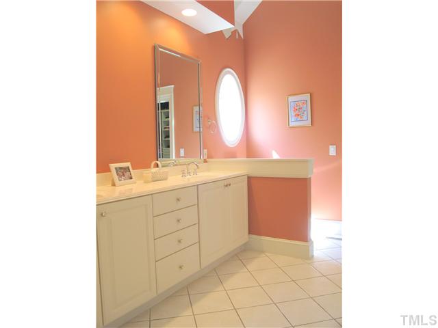 304 Marlowe Road Raleigh, NC 27609 - Photo 21 of 25 a spacious bathroom with a double vanity sink and a mirror