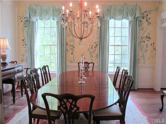 304 Marlowe Road Raleigh, NC 27609 - Photo 7 of 25 a view of a dining room with furniture window and wooden floor