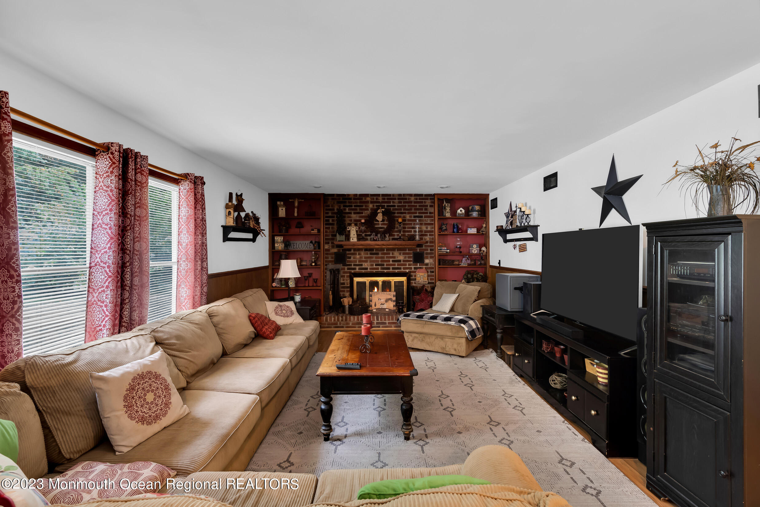 1216 Andover Road Brick, NJ 08724 - Photo 20 of 50 a living room with furniture and a flat screen tv