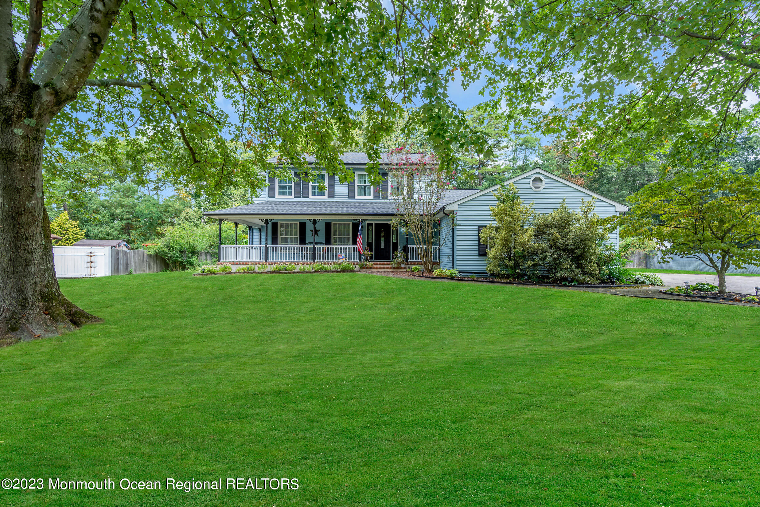 1216 Andover Road Brick, NJ 08724 - Photo 2 of 50 a front view of a house with a garden