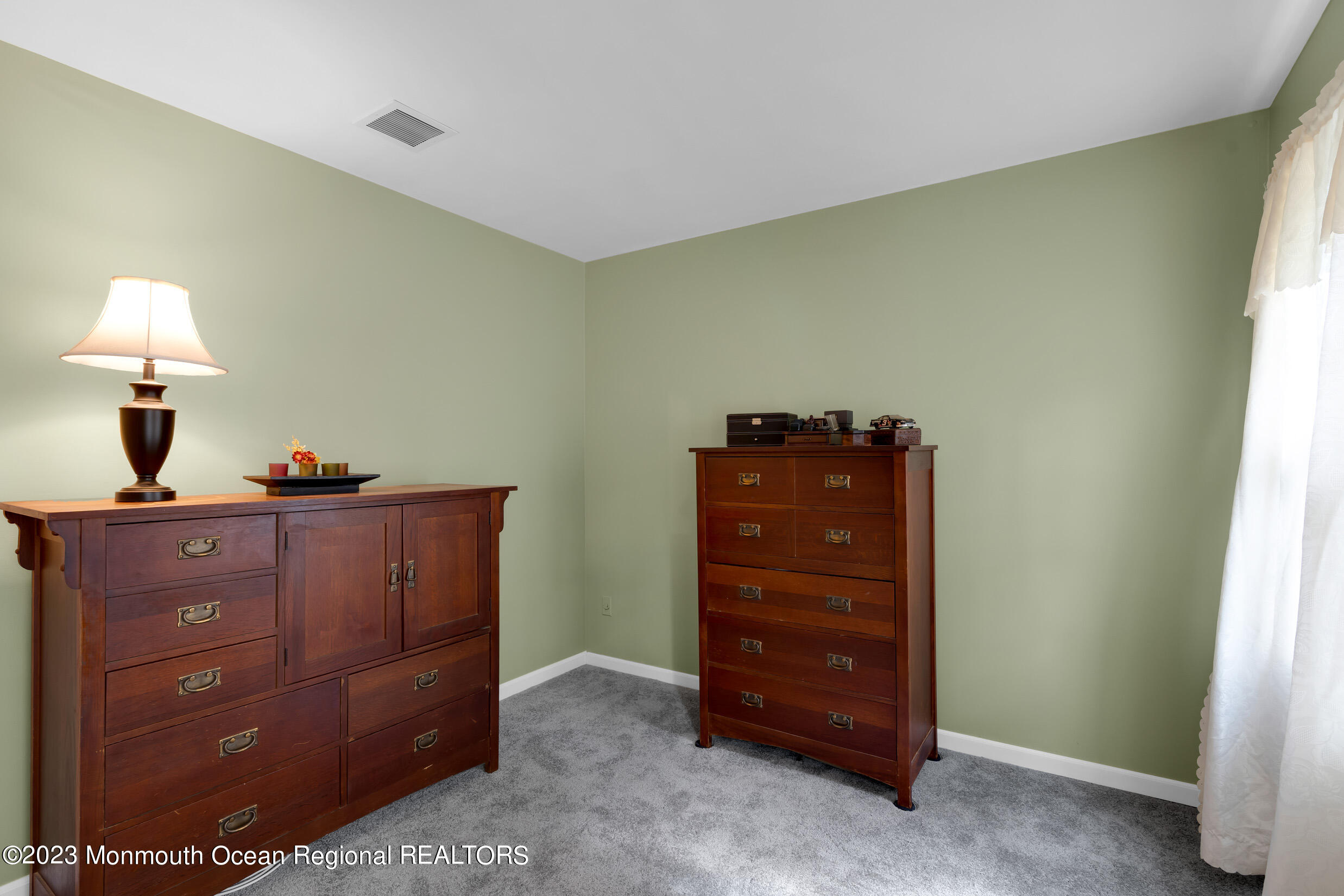 1216 Andover Road Brick, NJ 08724 - Photo 30 of 50 a room with a dresser and a mirror