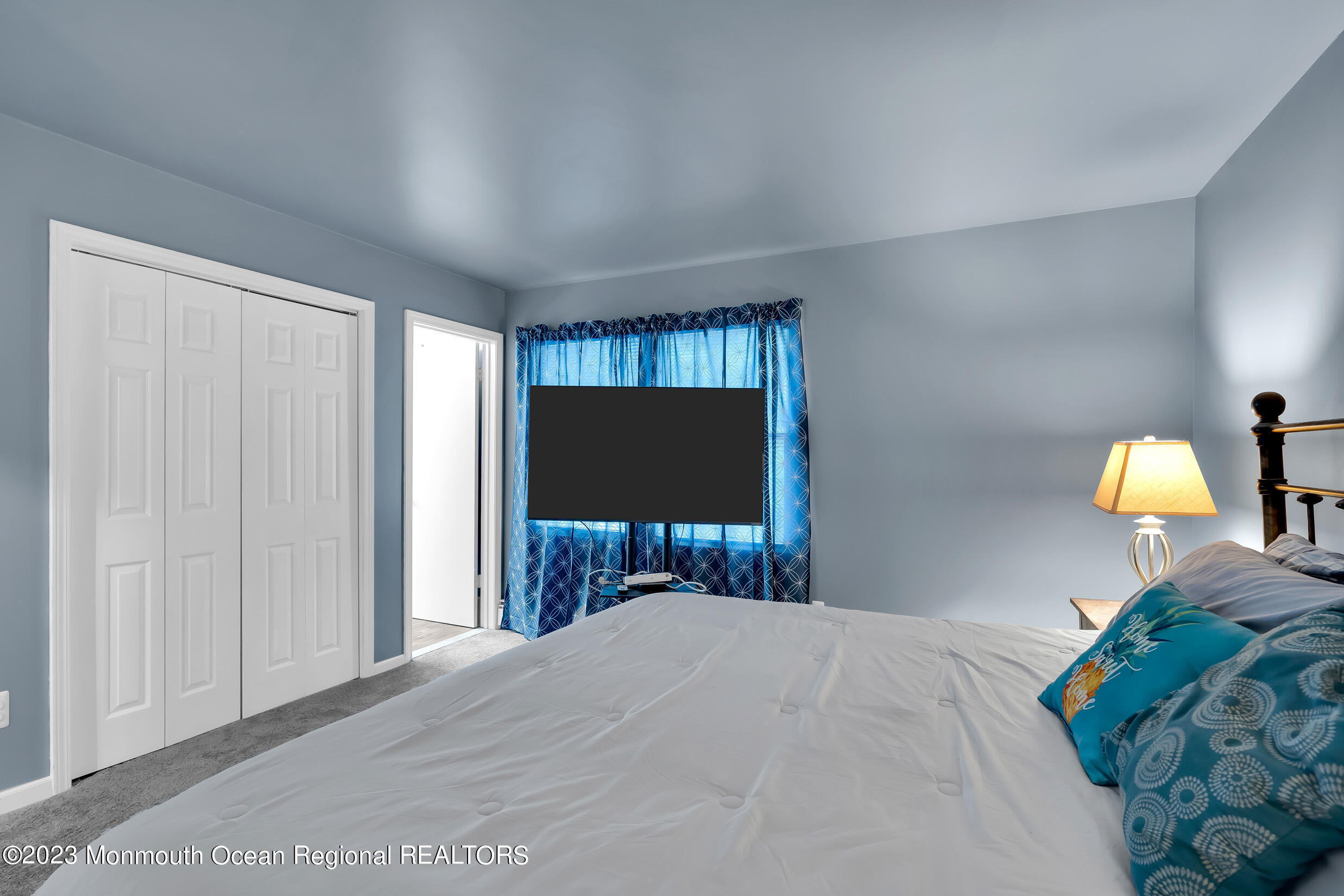 1216 Andover Road Brick, NJ 08724 - Photo 32 of 50 a bedroom with a bed and a flat screen tv