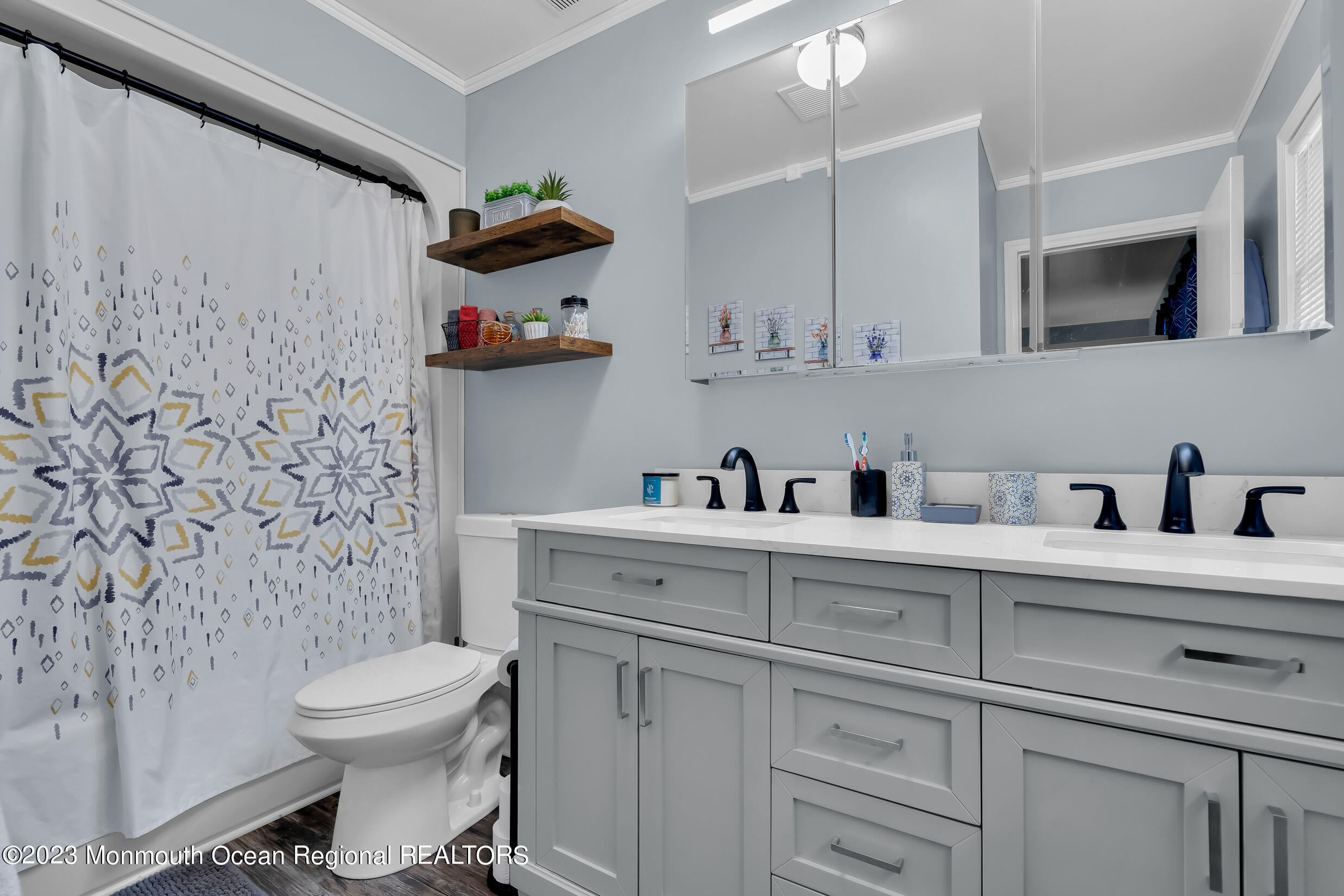 1216 Andover Road Brick, NJ 08724 - Photo 33 of 50 a bathroom with a toilet sink and mirror