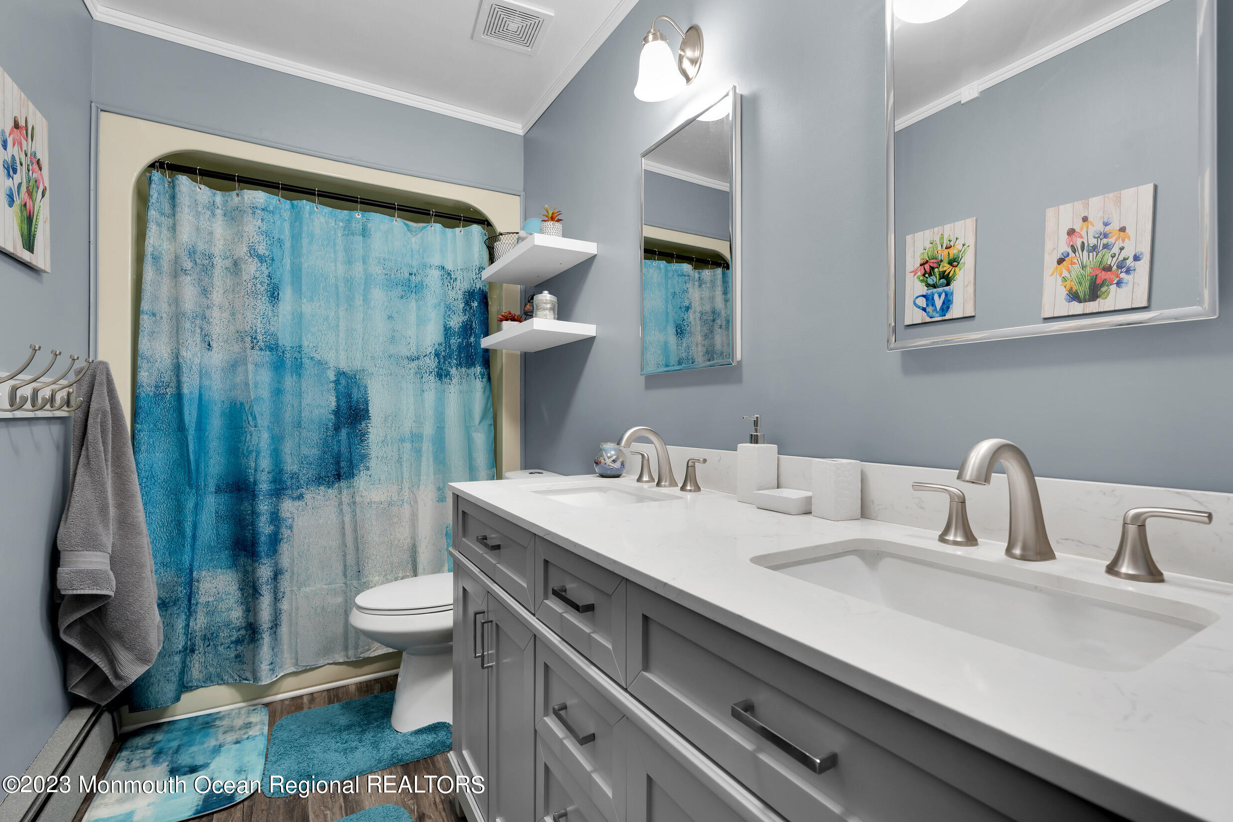 1216 Andover Road Brick, NJ 08724 - Photo 36 of 50 a bathroom with a sink a toilet and shower