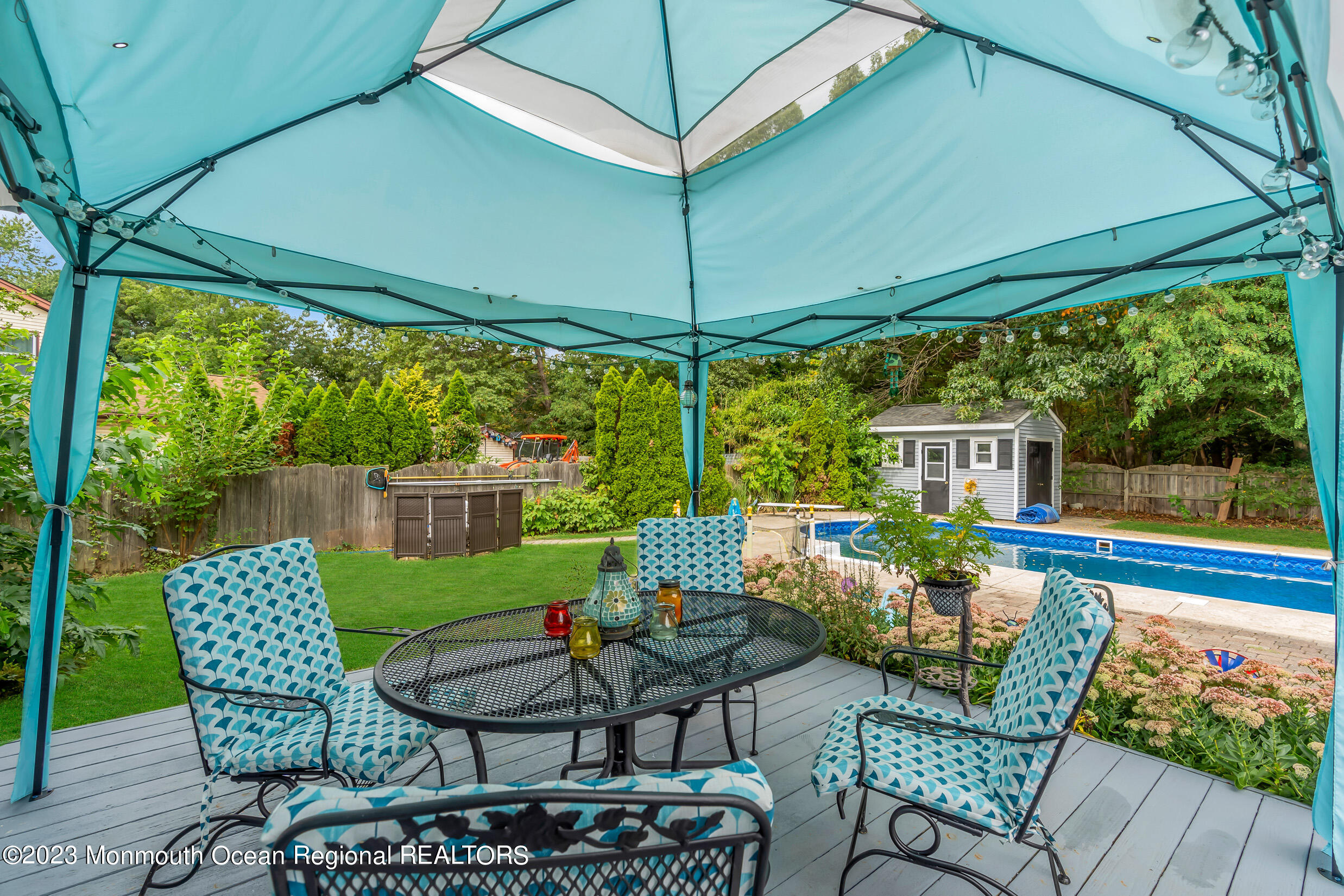 1216 Andover Road Brick, NJ 08724 - Photo 44 of 50 a view of a patio with couches chairs potted plants and a table