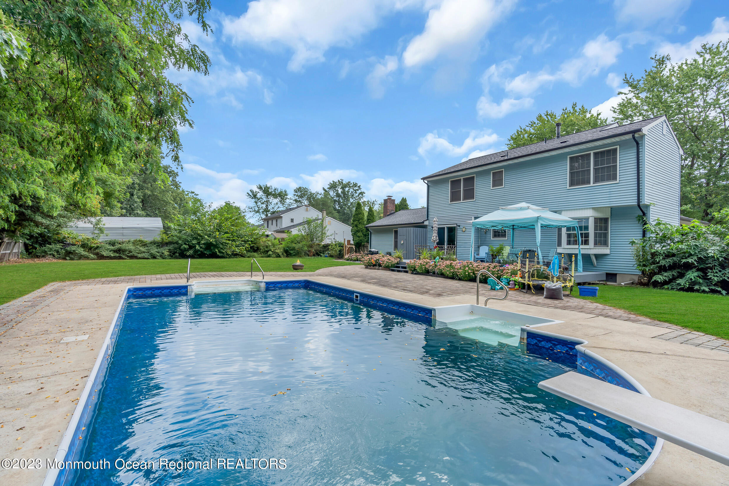 1216 Andover Road Brick, NJ 08724 - Photo 47 of 50 a view of a swimming pool with sitting area and slide