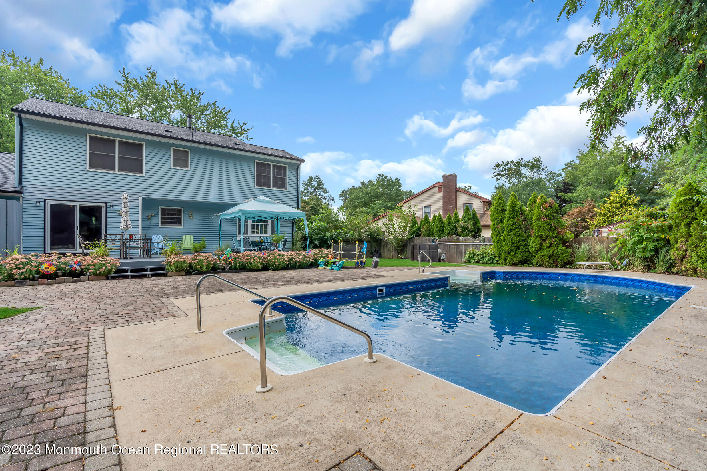 1216 Andover Road Brick, NJ 08724 - Photo 48 of 50 a view of a swimming pool with sitting area
