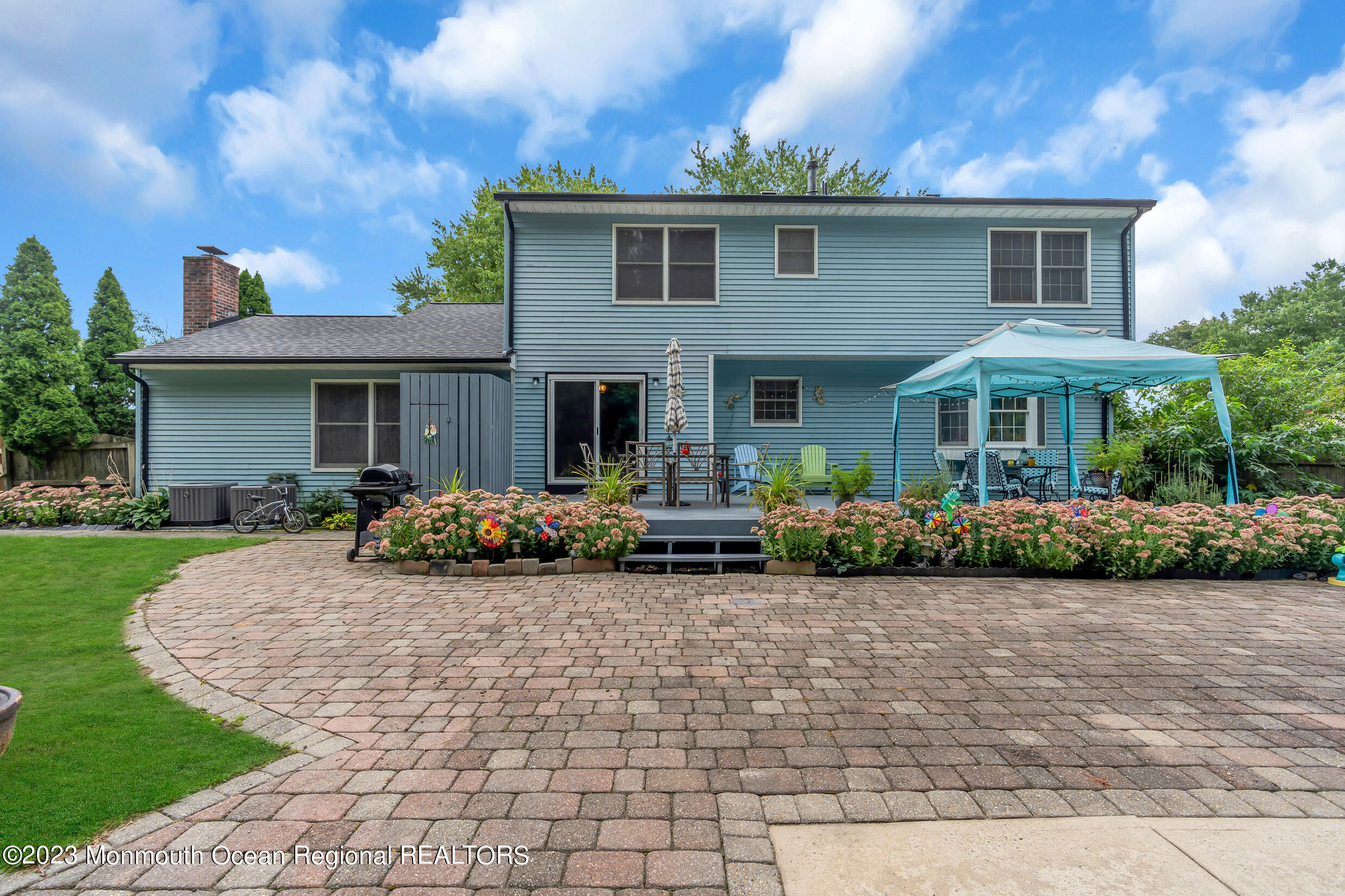 1216 Andover Road Brick, NJ 08724 - Photo 49 of 50 a front view of a house with yard and porch