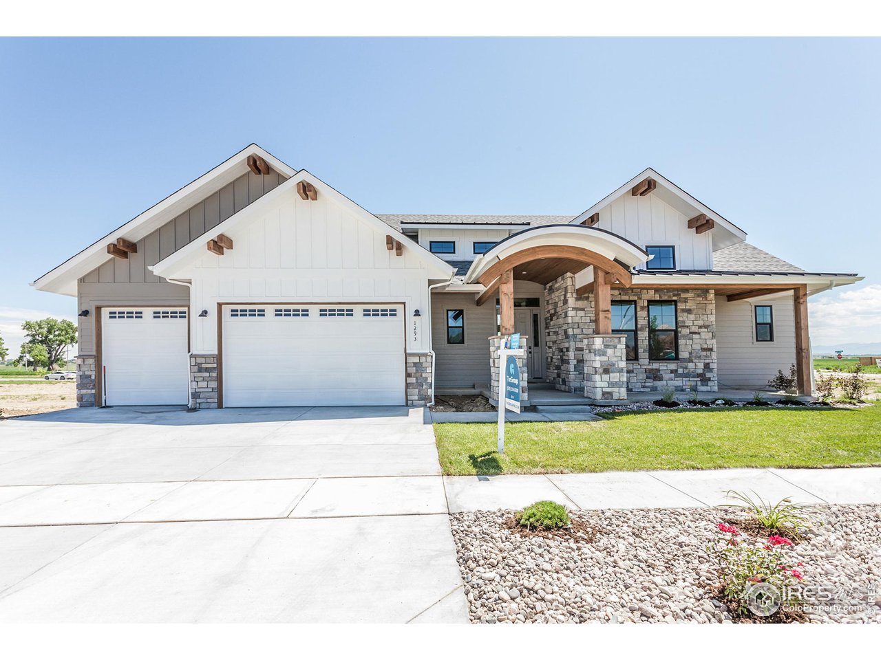 a view of a house with a swimming pool and a yard