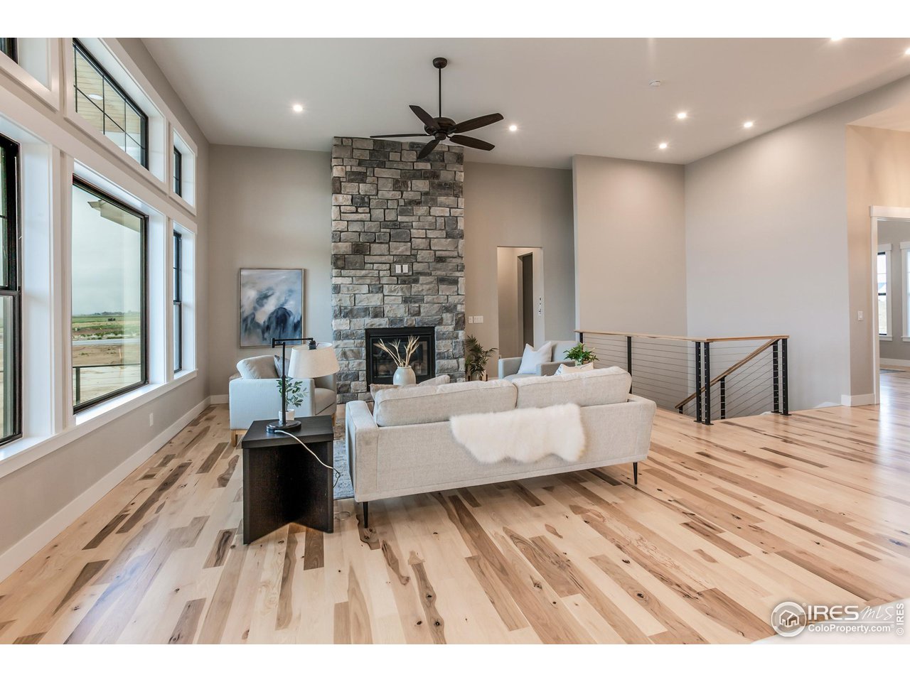 1293 Burt Avenue Berthoud, CO 80513 - Photo 11 of 40 a living room with furniture and a fireplace