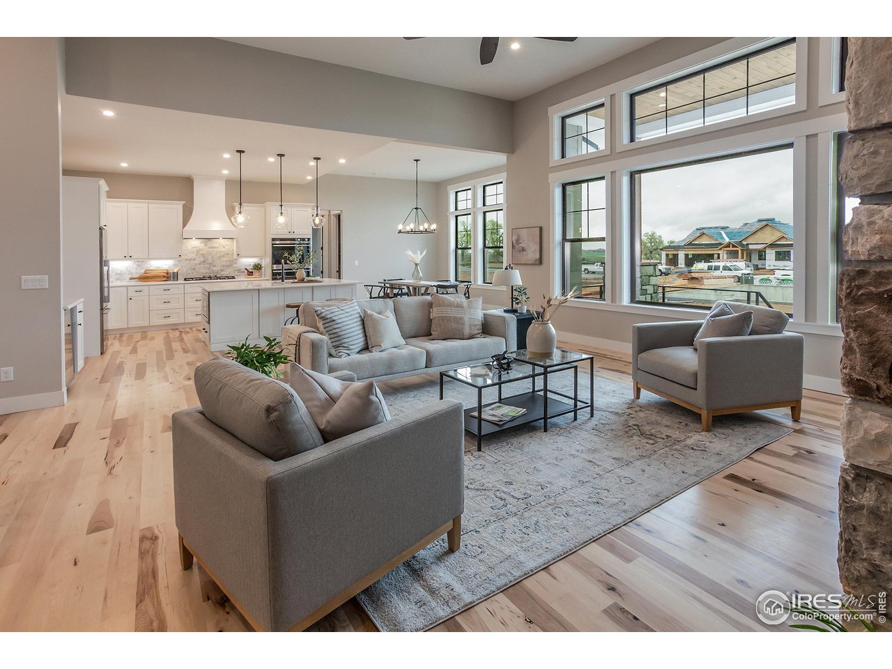 1293 Burt Avenue Berthoud, CO 80513 - Photo 12 of 40 a living room with furniture and a large window