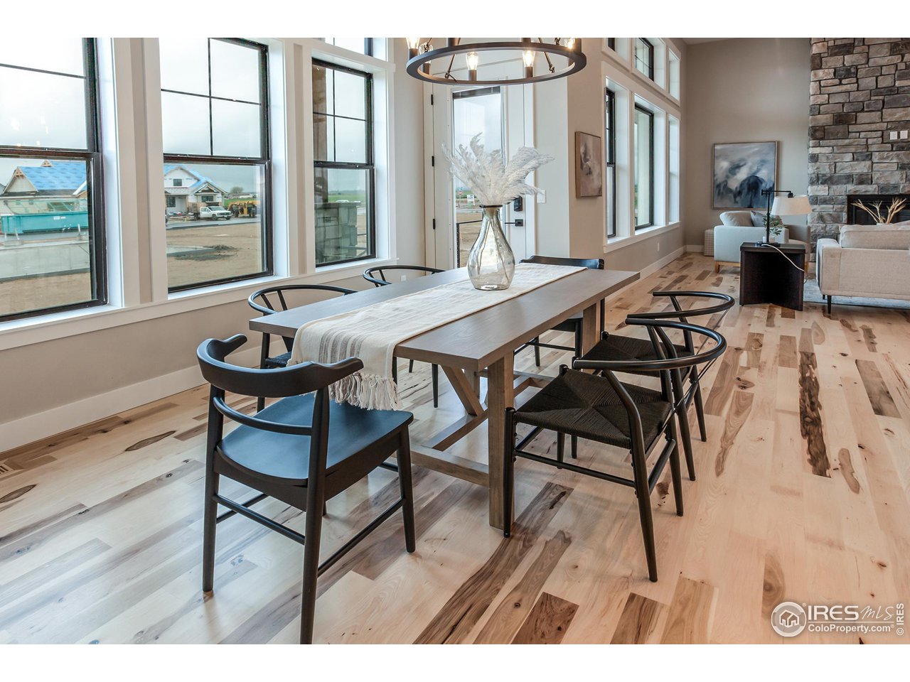 1293 Burt Avenue Berthoud, CO 80513 - Photo 21 of 40 a view of a dining room with furniture and wooden floor