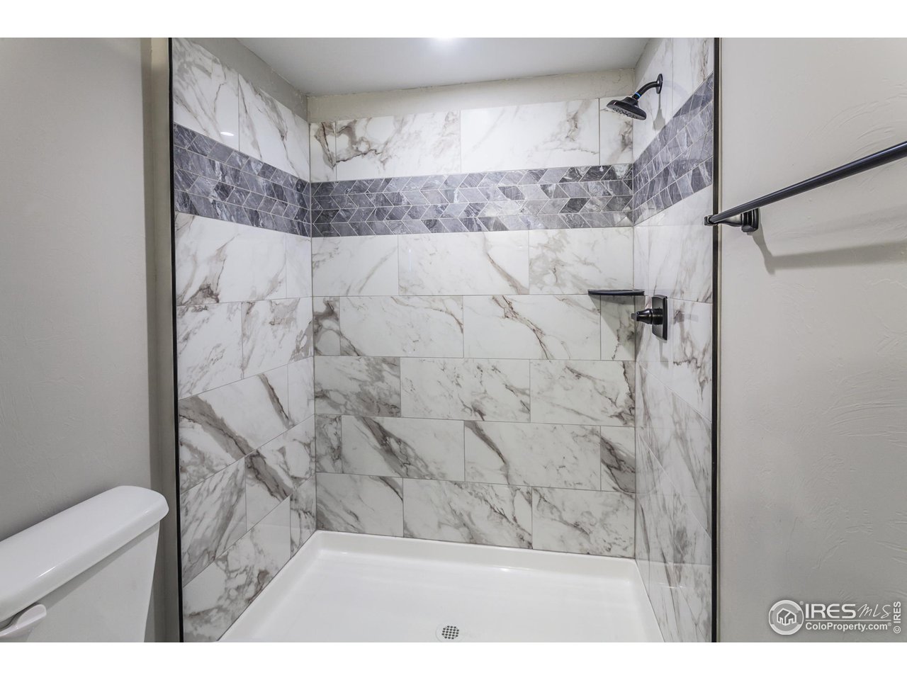 1293 Burt Avenue Berthoud, CO 80513 - Photo 36 of 40 a bathroom with a shower