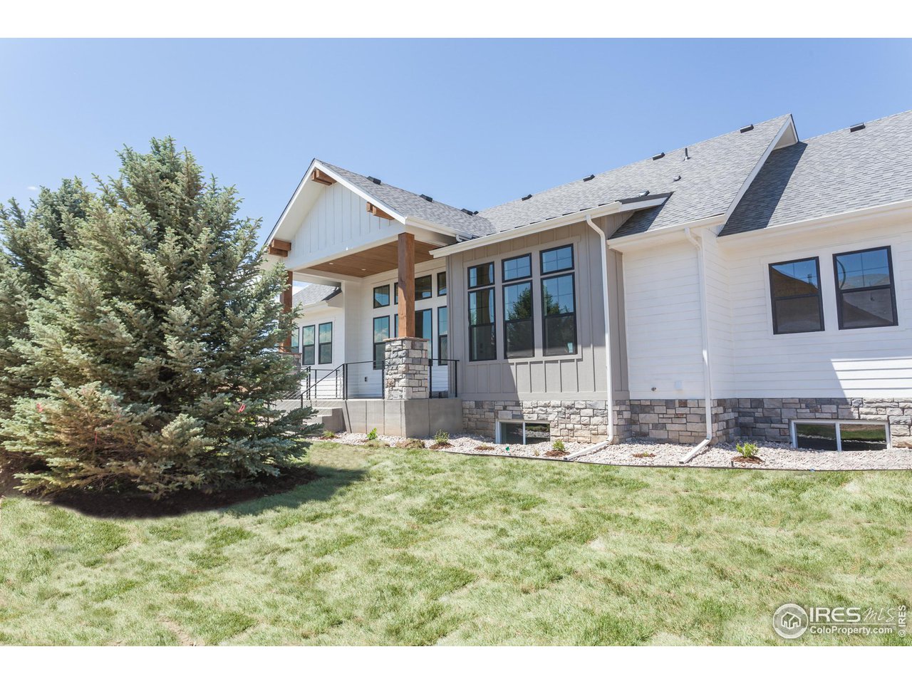 1293 Burt Avenue Berthoud, CO 80513 - Photo 37 of 40 a front view of a house with garden