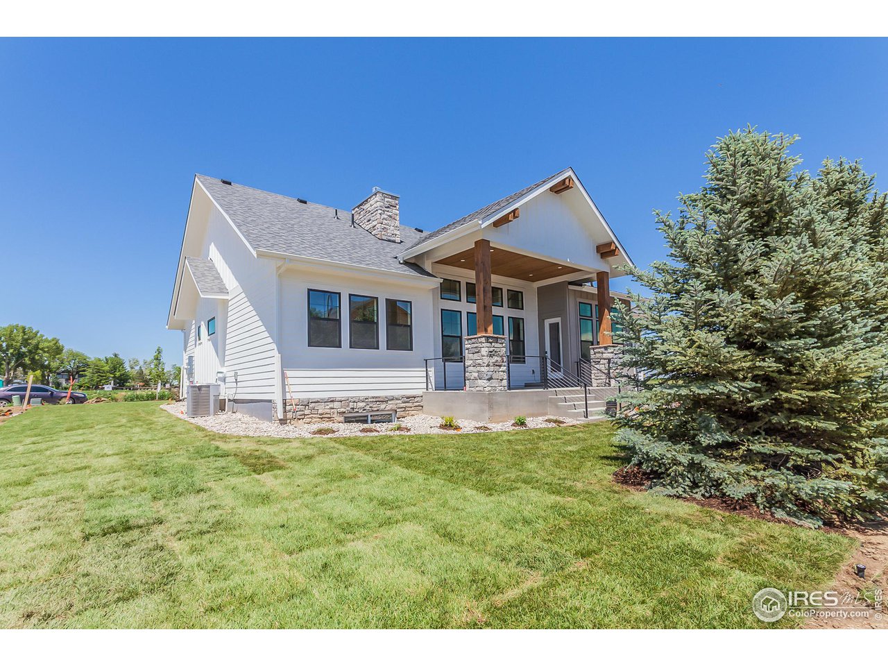 1293 Burt Avenue Berthoud, CO 80513 - Photo 38 of 40 a front view of a house with a yard