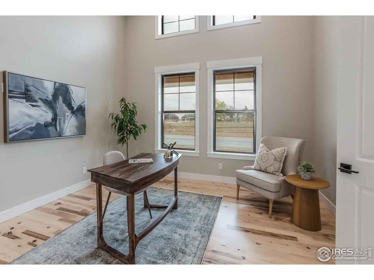 1293 Burt Avenue Berthoud, CO 80513 - Photo 5 of 40 a living room with furniture and a window