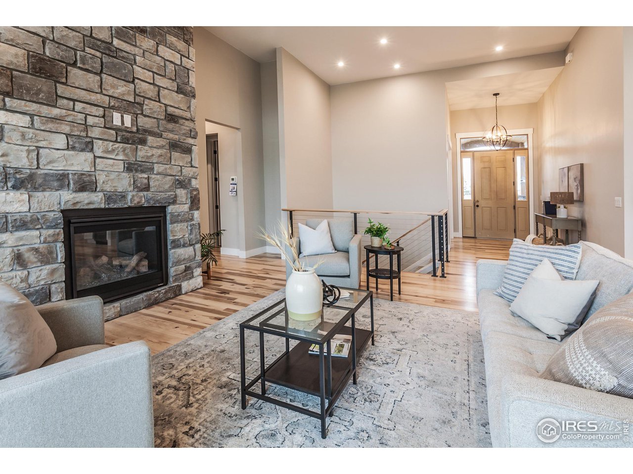 1293 Burt Avenue Berthoud, CO 80513 - Photo 8 of 40 a living room with furniture and a fireplace