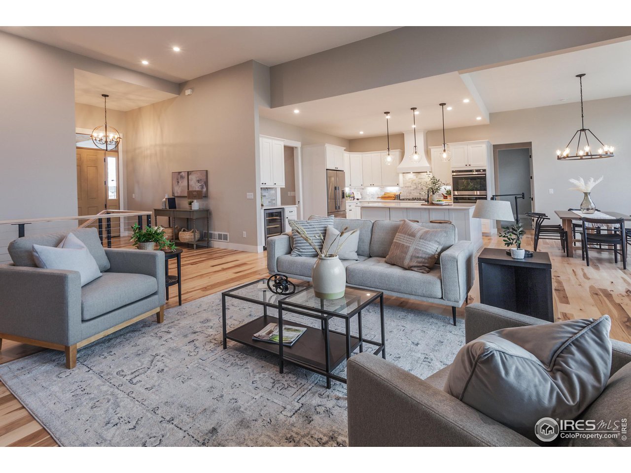1293 Burt Avenue Berthoud, CO 80513 - Photo 9 of 40 a living room with furniture and kitchen view