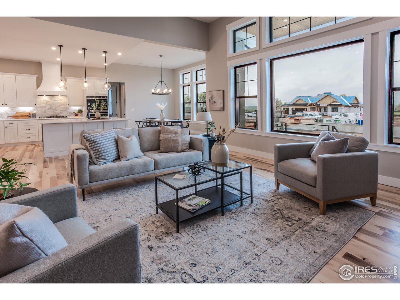 1293 Burt Avenue Berthoud, CO 80513 - Photo 10 of 40 a living room with furniture and a large window